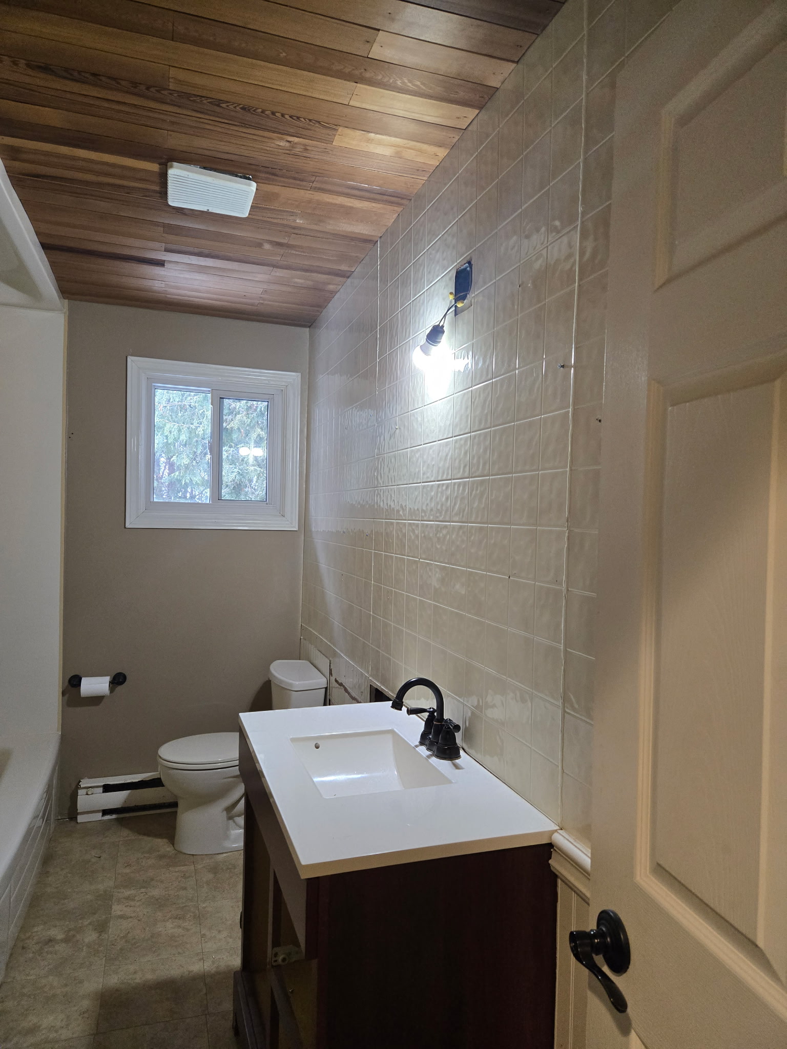 Before the washroom renovation (right wall with sink)